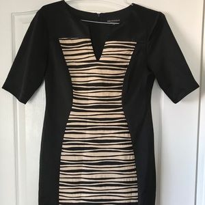Black woman dressed in striped design. Size 12